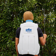 Back view of person wearing white 20L/5gal GROW electric sprayer backpack.