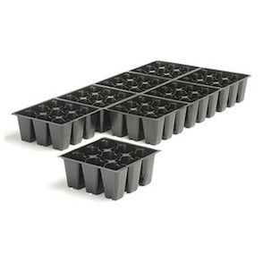 Black 72-cell seedling trays with hexagonal cells, one tray in foreground, several in background.