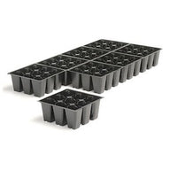 Black 72-cell seedling trays with hexagonal cells, one tray in foreground, several in background.