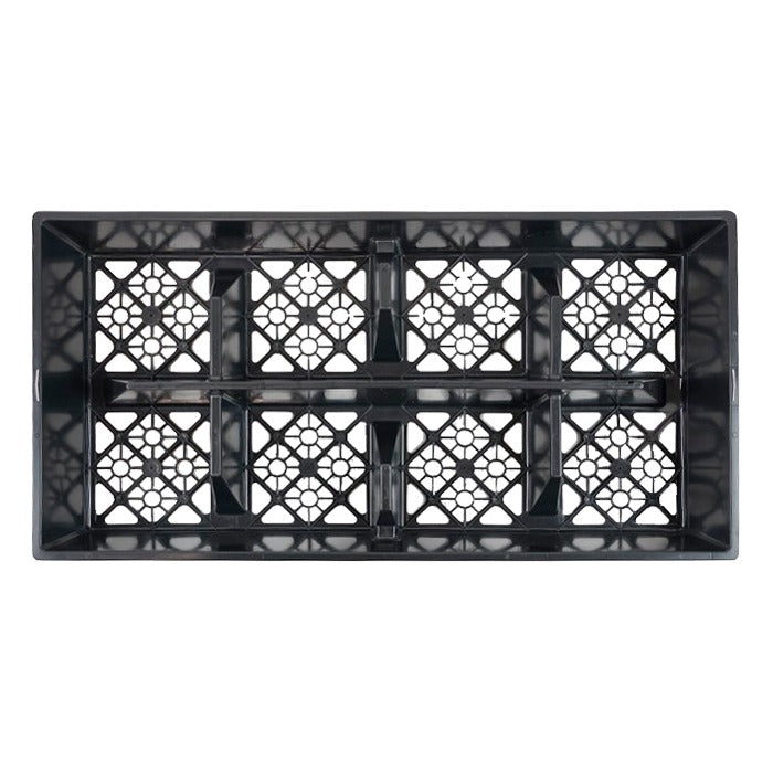 Black plastic grow tray with open square compartments, viewed from above.