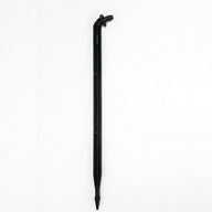 Black angled barbed drip stake with pointed end on white background.