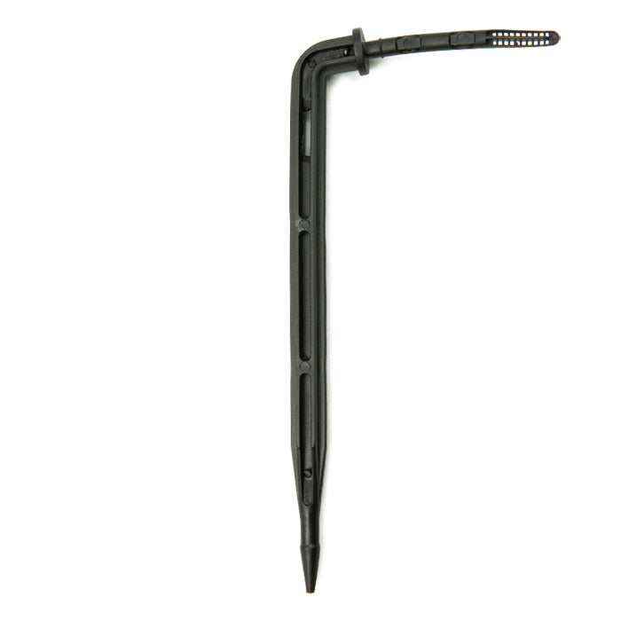 Angled black plastic drip irrigation stake with a pointed end and a perforated tip.