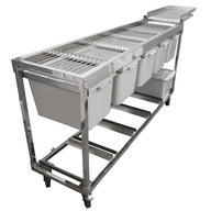 Commercial stainless steel harvest sorting table with grated top, multiple bins, lower storage, and casters.