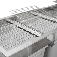 Top-down close-up of a stainless steel harvest sorting system with metal grates, one lifted, and collection bins.