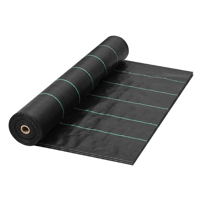 Black landscape fabric weed barrier with green stripe guidelines, unrolled partially.