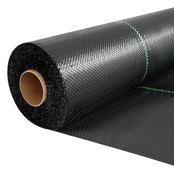 Black woven landscape fabric on a roll with green stripes.