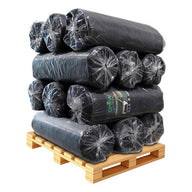 Black weed mat rolls stacked on a wooden pallet.