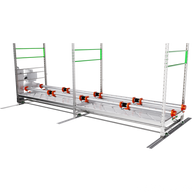 A long, multi-tiered grow rack with orange lights and green accents, designed for under-canopy lighting.