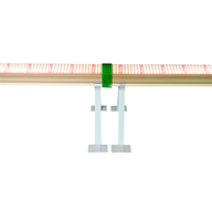 Red-enhanced LED grow light bar mounted on a shelf with white clips.