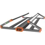 Folded GrowPros Eagle LED grow light. Dark gray frame, orange accents. Control panel and colorful LED lights visible.