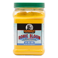 Humboldt County's Own Sonic Bloom flowering booster in a clear plastic jug with a green lid, containing yellow powder.
