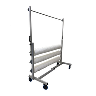 High Roller Cannabis Trellis Netting System with three rolls of netting on a mobile rack.