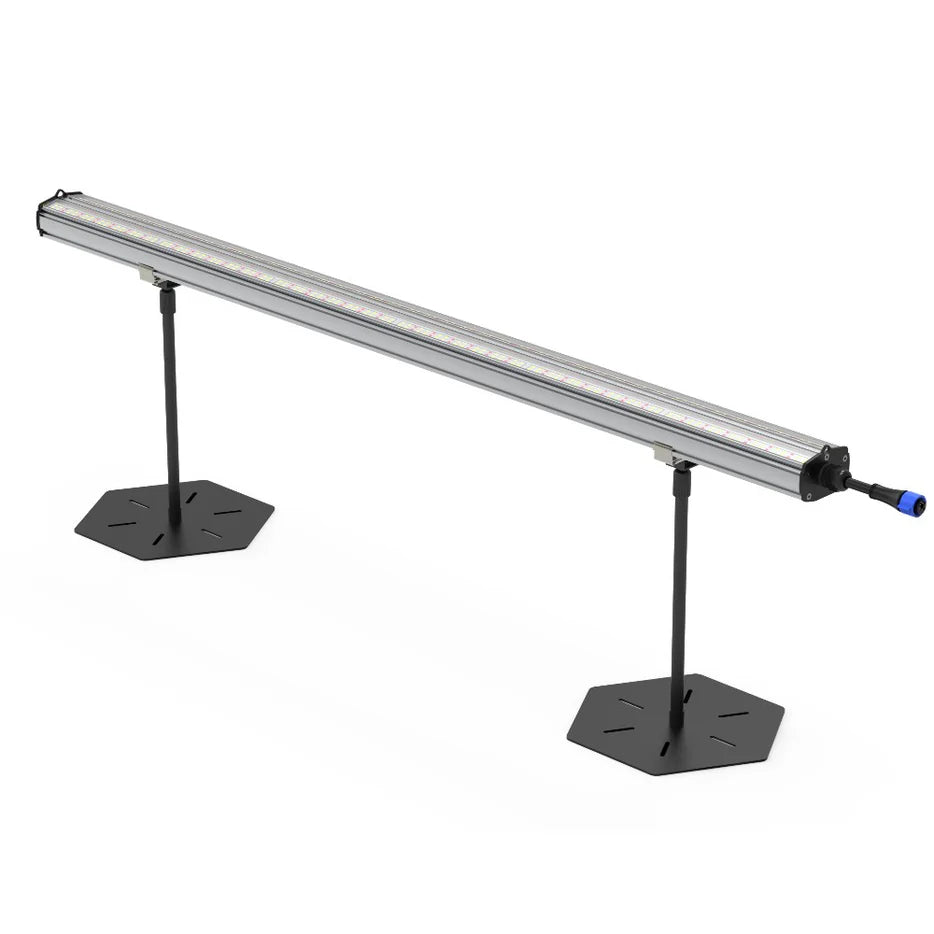 Silver linear 120W LED grow light bar with visible LEDs, on two black hexagonal stands. For under canopy.