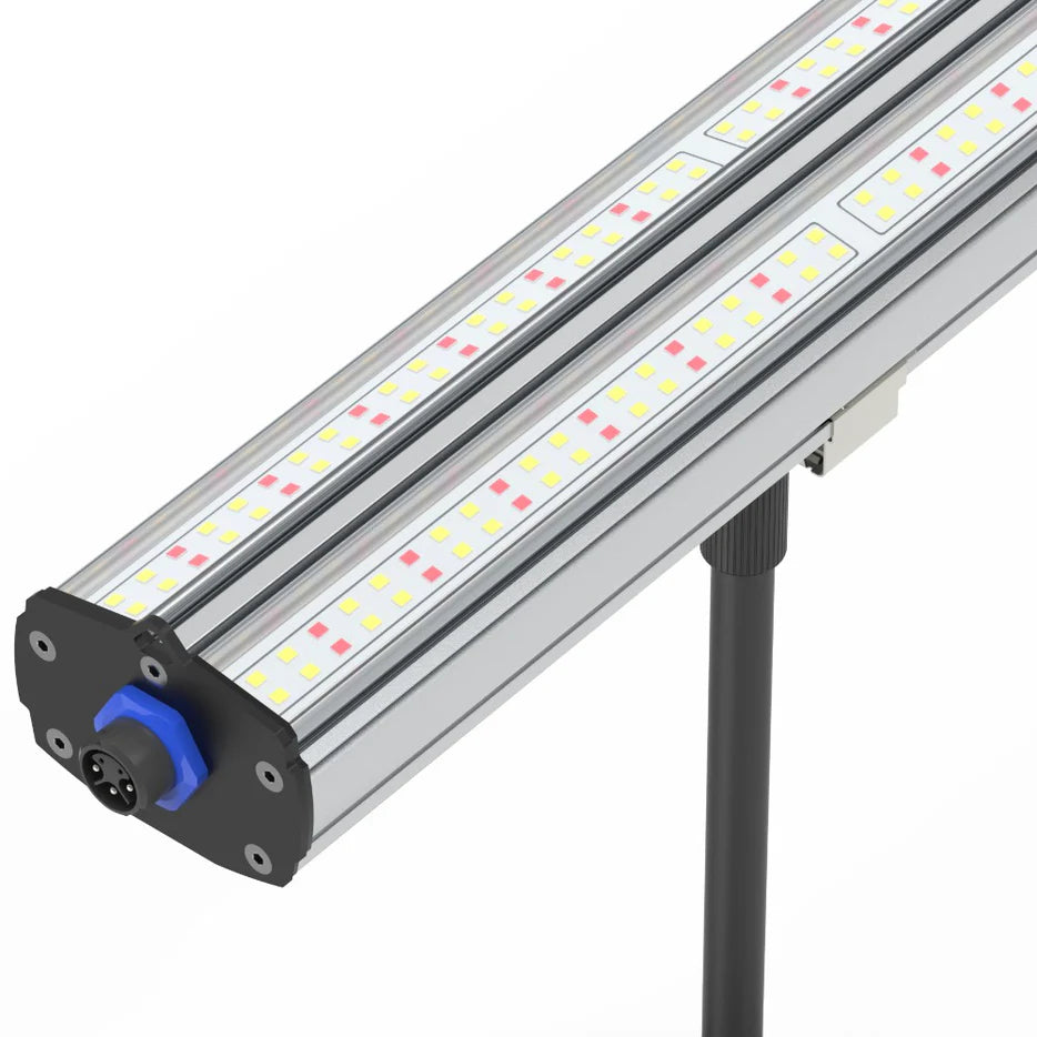 Close-up of a HortiBloom LED grow light: silver fixture with red/yellow chips, blue connector, on a black pole.