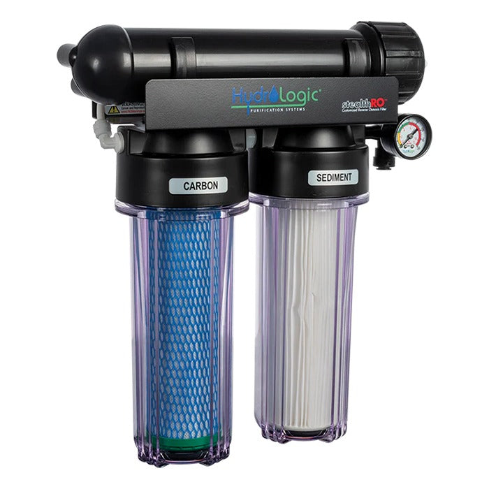 HydroLogic Stealth-RO water filter with two transparent canisters labeled "CARBON" and "SEDIMENT" and a pressure gauge.