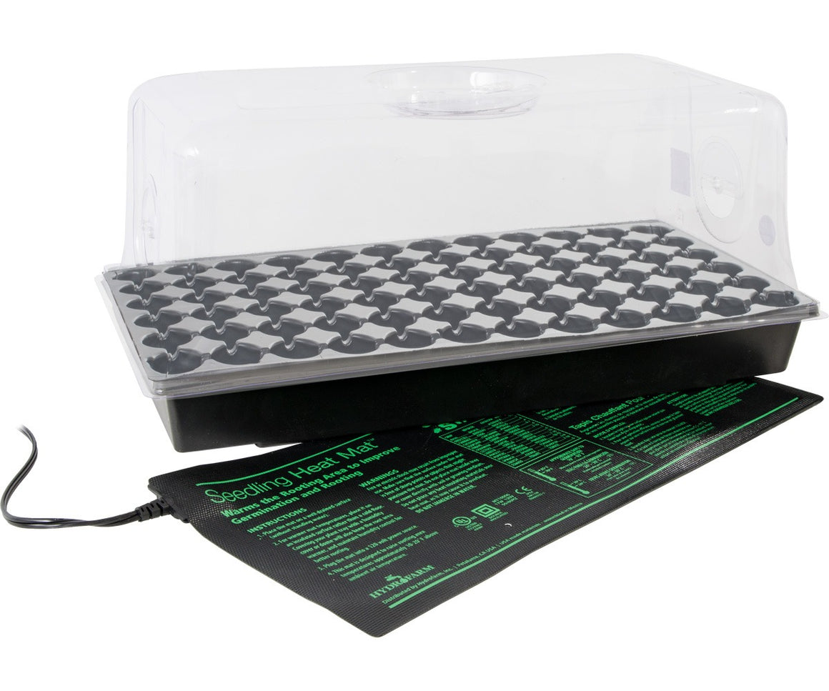 Seedling heat mat with a black tray, 72-cell insert, and clear dome for plant germination.