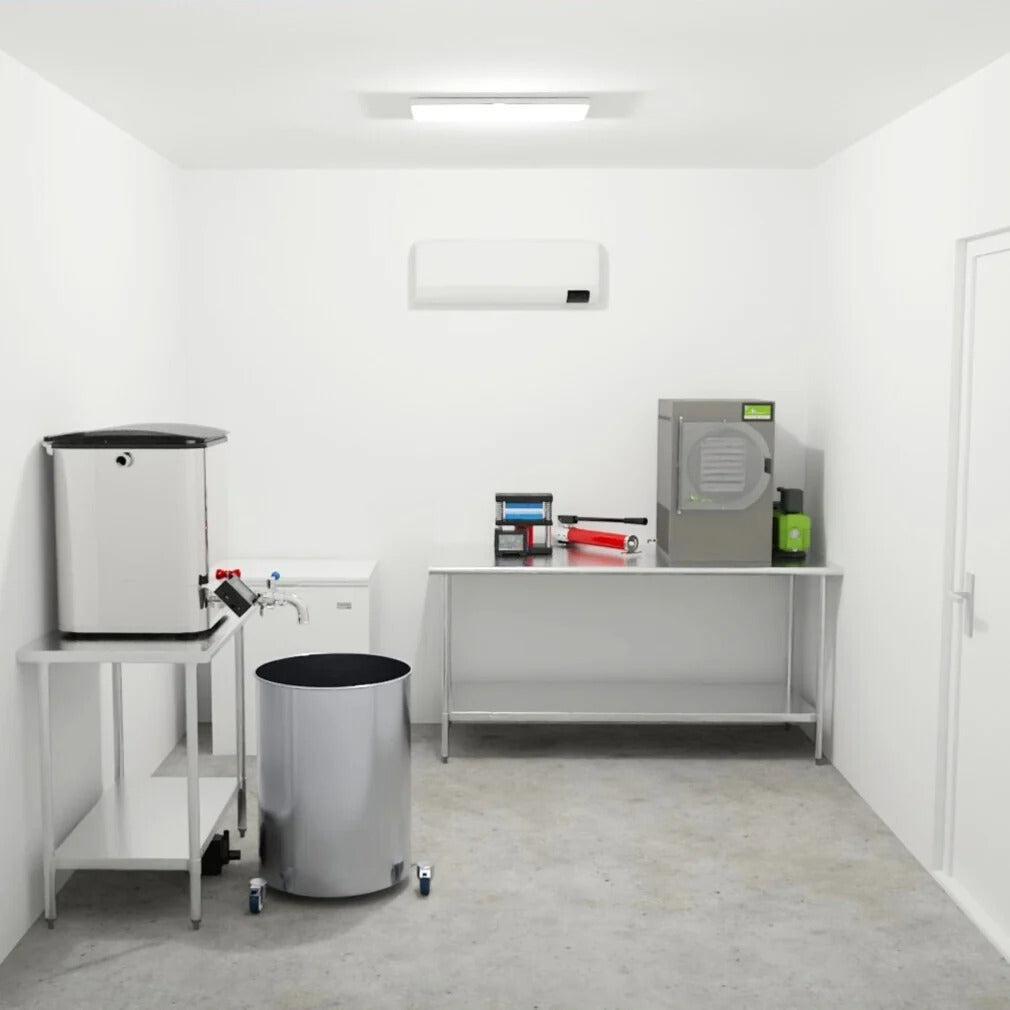 Industrial drying machine, ice machine, and stainless steel tank in a clean room.