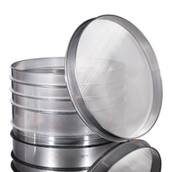 Stack of silver sieves, one open showing mesh, with 