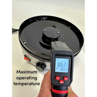 Black Myco Labs mushroom dehydrator with IR thermometer displaying 165.7°F maximum operating temperature.