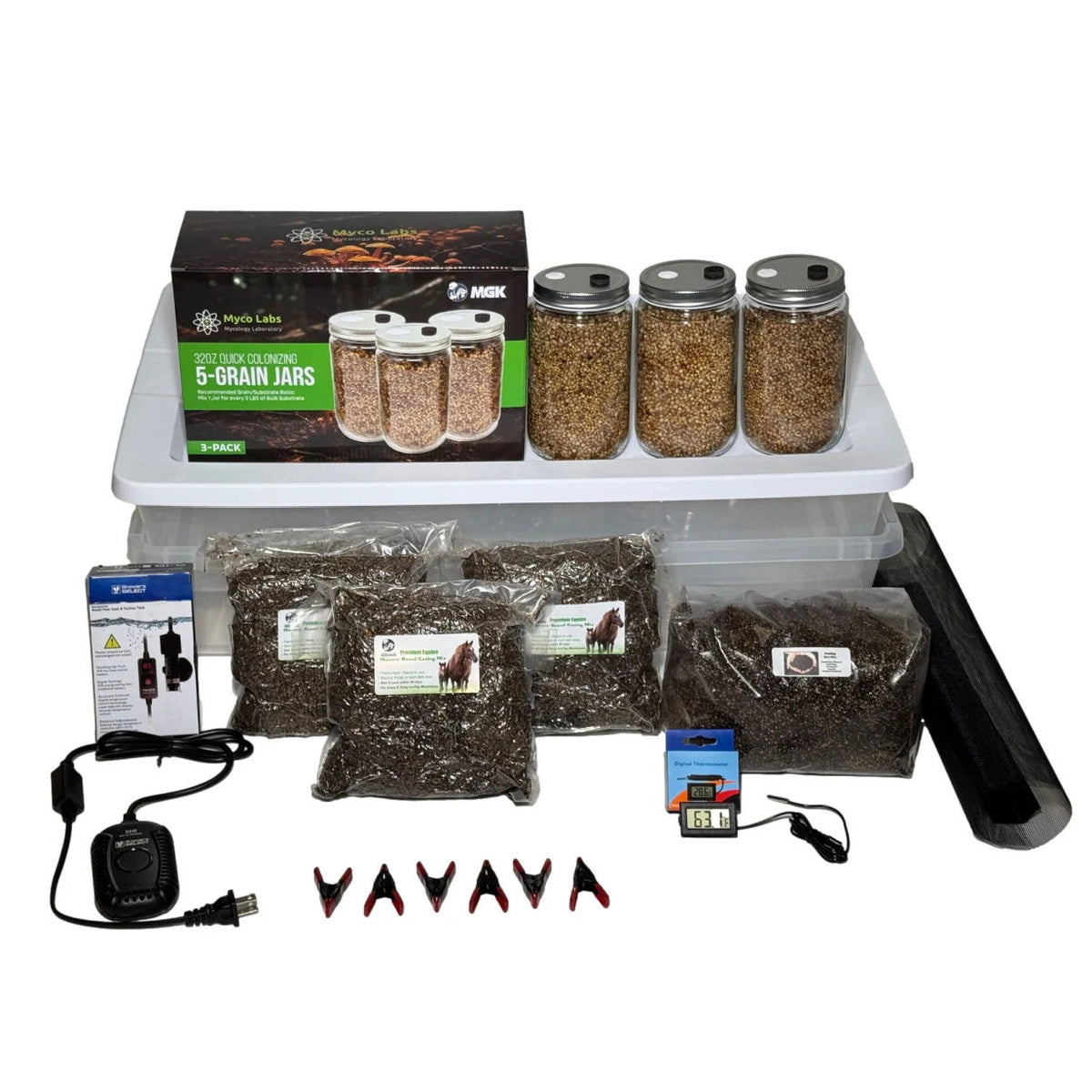 Mushroom growing kit featuring grain spawn jars, substrate bags, digital thermometer, heating pad, and accessories.