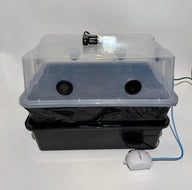Grow tent with clear lid, LED light, humidity sensor, air pump, and black plastic basin.