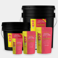 RAW Microbes Bloom Stage nutrients in black buckets and pink/yellow pouches.