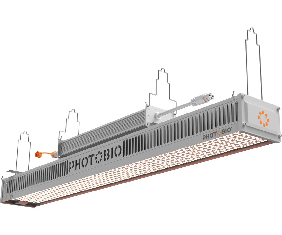 PHOTOBIO TX2 LED grow light with orange logo, white housing, and array of white LEDs.