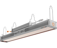 PHOTOBIO TX2 LED grow light with orange logo, white housing, and array of white LEDs.