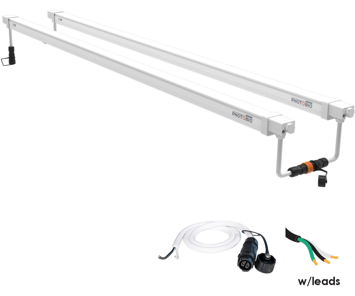 Two white PHOTOBIO VP LED grow lights with connectors and cords, for growing plants.