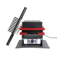 Close-up of a device with multiple stacked components and a black ribbed arm.