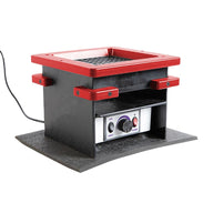 Square black vacuum forming machine with red trim and controls, on a textured base.