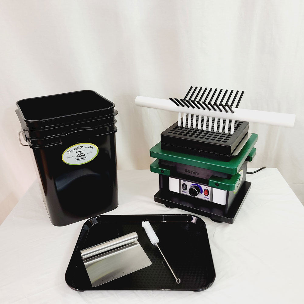 Black ProRoll Press Inc. bucket, green capsule filler, white tamping tool, and black tray with scraper and brush.