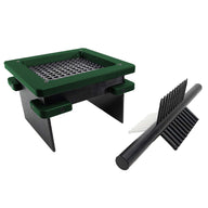 Green grill with metal grate and black arrow-shaped accessory.