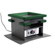 Green-rimmed, square prepress device with a dial and power button on a white panel.