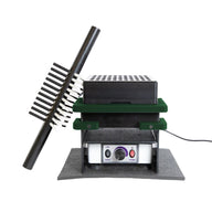A stacked device with a black comb-like attachment, a black and green layered unit, and a white control panel with a knob and buttons.
