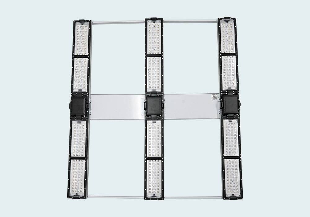 Full-spectrum LED grow light with multiple panels on a silver frame.