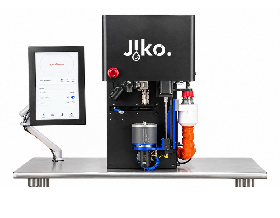 Jiko Plus machine with touchscreen, emergency stop, and robotic arm.