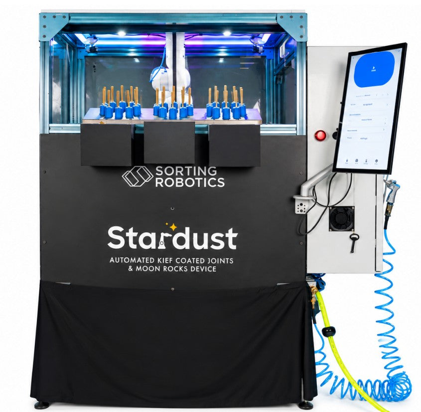 Sorting Robotics Stardust device: automated joint coating machine with robotic arm, screen, and air hose.