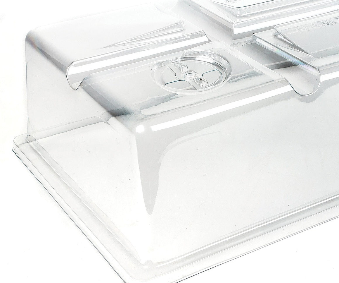 Clear plastic seedling dome with vents, offering a greenhouse effect for plants.