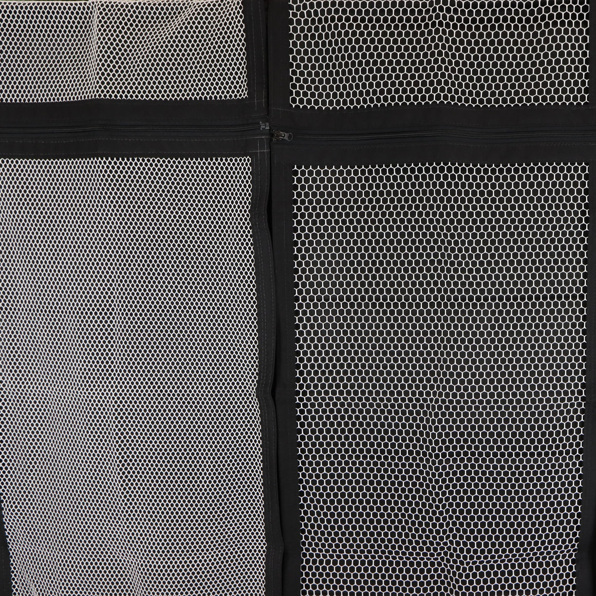 Close-up of two white mesh panels with black borders and zippers.