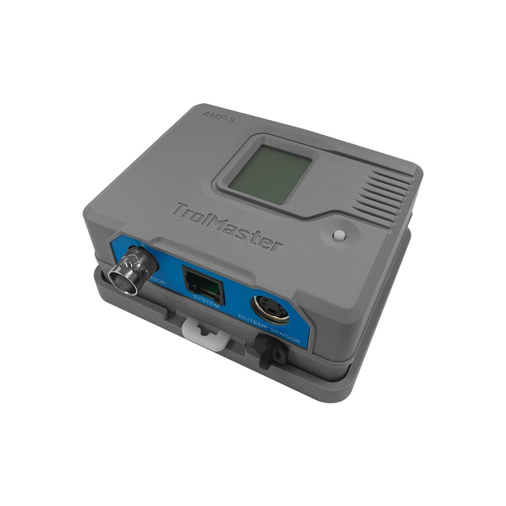 Gray TrolMaster AMP-3 greenhouse controller with screen, ports labeled "SENSOR," "SYSTEM," and "EC/TEMP SENSOR."