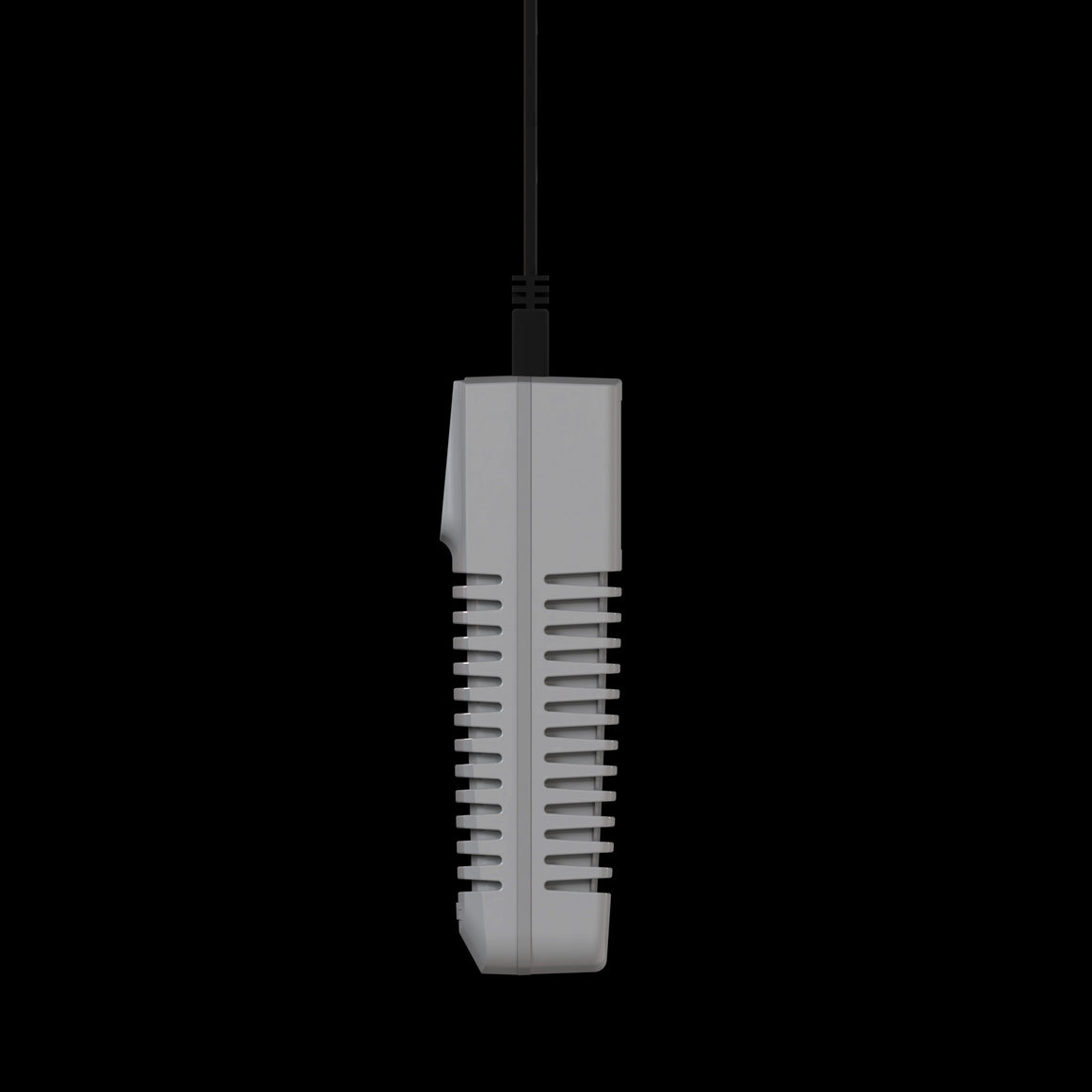 Gray greenhouse controller with black cable against black background.
