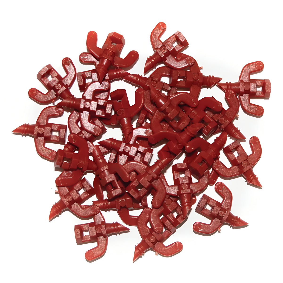 Pile of red plastic cloner spray jets, for hydroponics, white background.