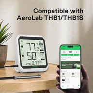 VIVOSUN temperature and humidity sensor with LCD screen displaying 77°F and 58%, connected to smartphone app.