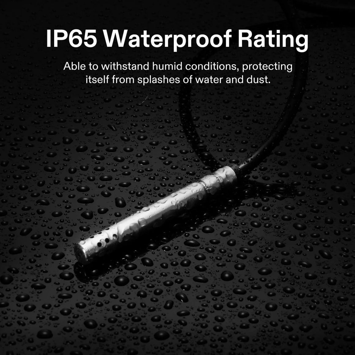 Silver temperature/humidity sensor probe with IP65 waterproof rating on a wet black surface.
