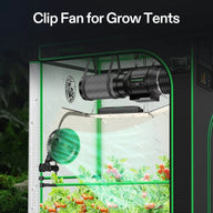 Green VIVOSUN clip fan in a grow tent, circulating air around tomato plants. Features air filter, LED grow light for cultivation.