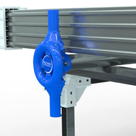 A blue Wachsen Professional bench crank attached to a metal rolling bench.