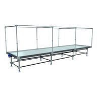 Professional rolling bench with a wide grow surface and overhead support structure.