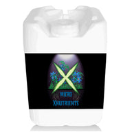 White liquid nutrient jug with black label featuring glowing green 'X', blue flowers, roots, and 'MICRO XNUTRIENTS'.