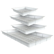 Four white flood tables with grids stacked in descending size, isolated on white.
